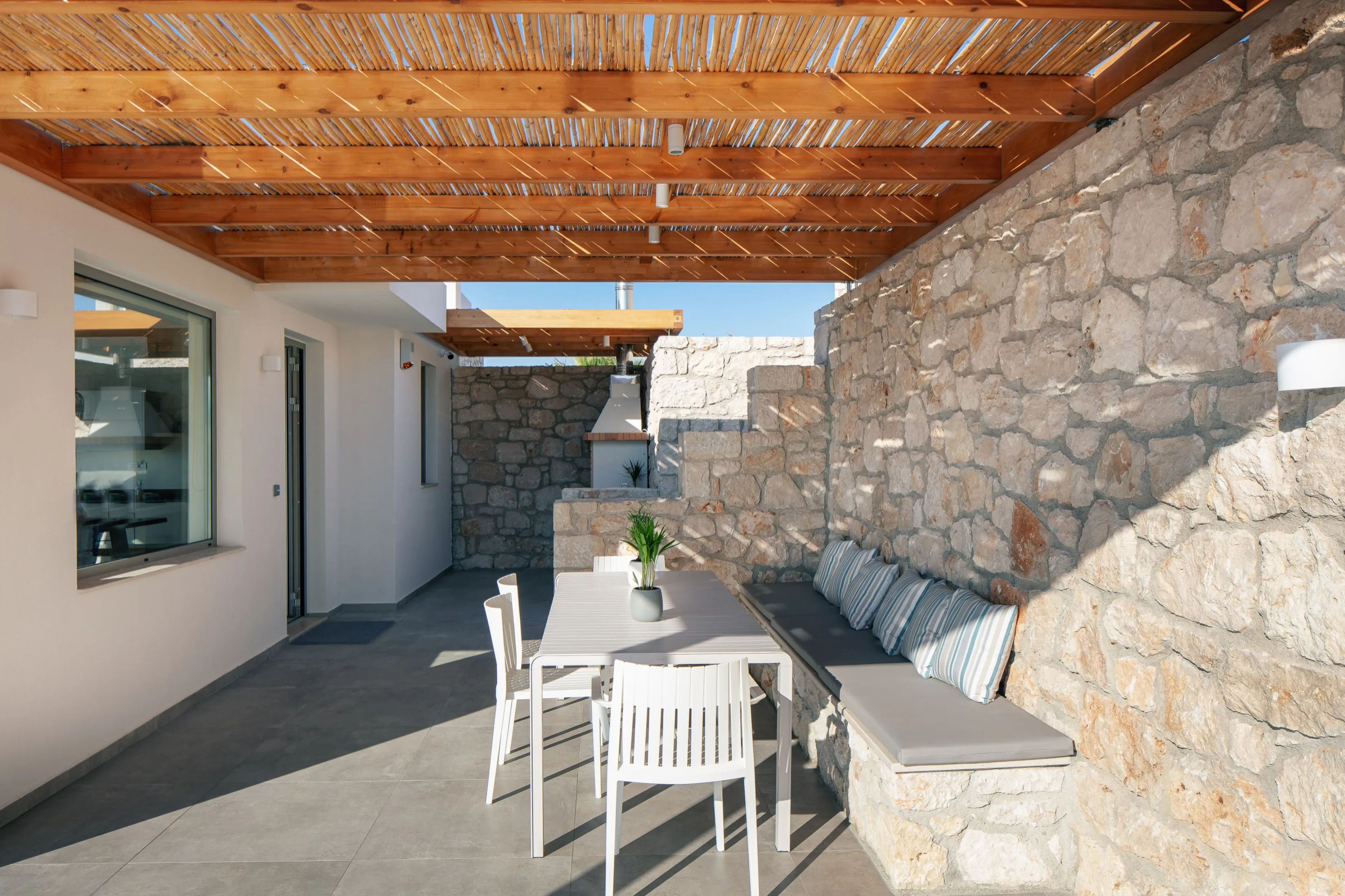 Outdoor dining area with charcoal barbecue
