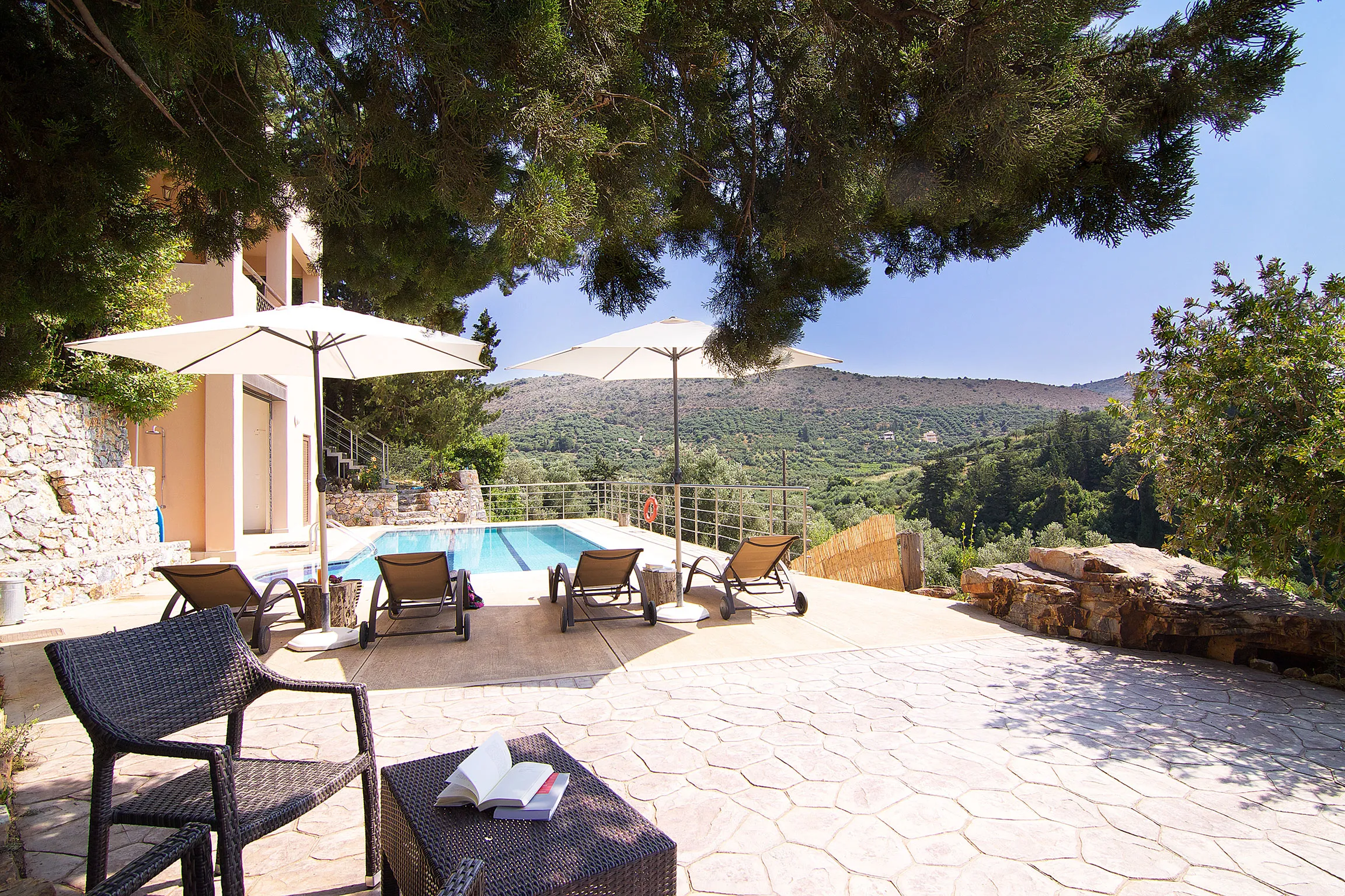 Relax under the trees next to the pool!