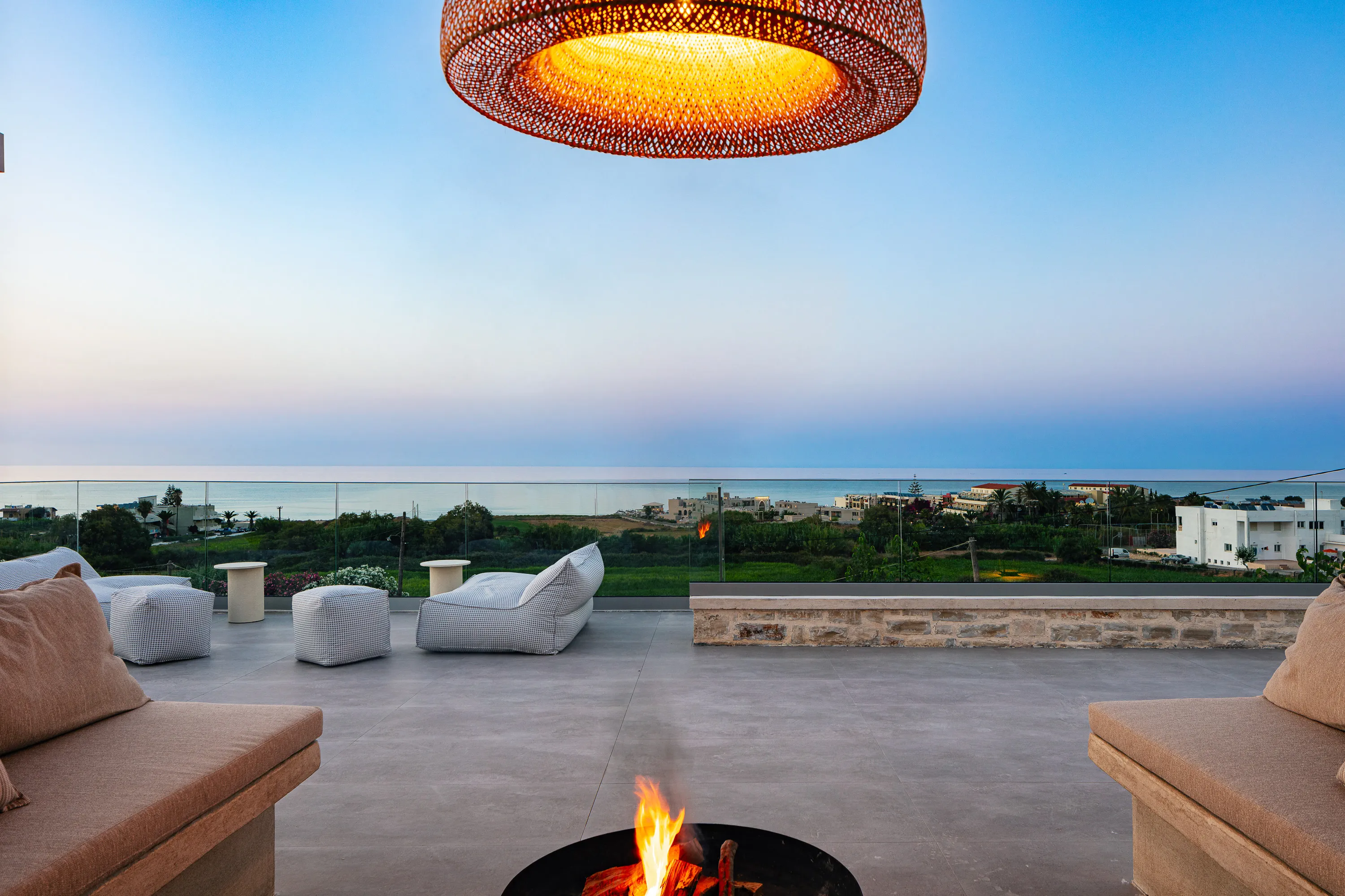 Unwind and savor breathtaking views of both the sea and the mountains, from our roof terrace, featuring a U-shaped seating area and a cozy fire pit for unforgettable gatherings