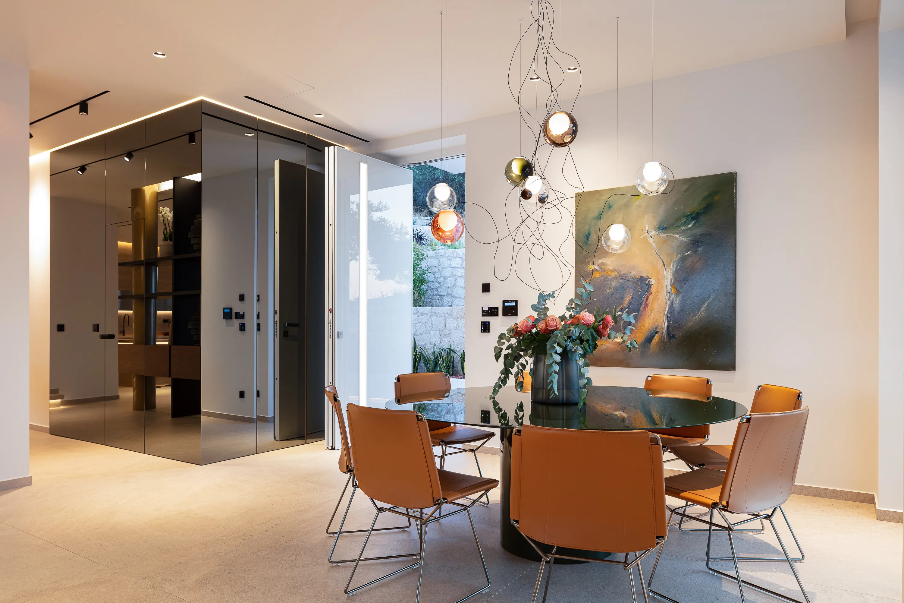 The dining table stands as the heart of the home, comfortably accommodating 8 guests.