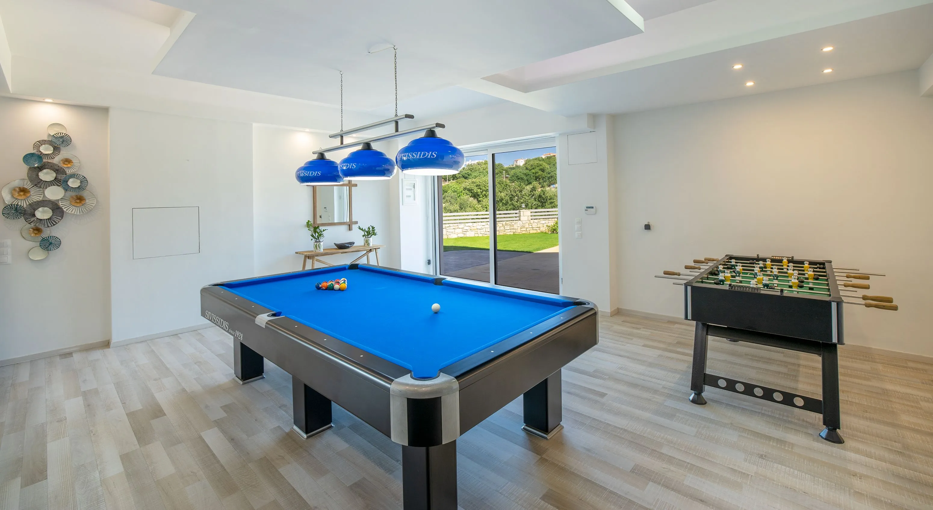 Playroom on the ground floor featuring a pool table and table football.