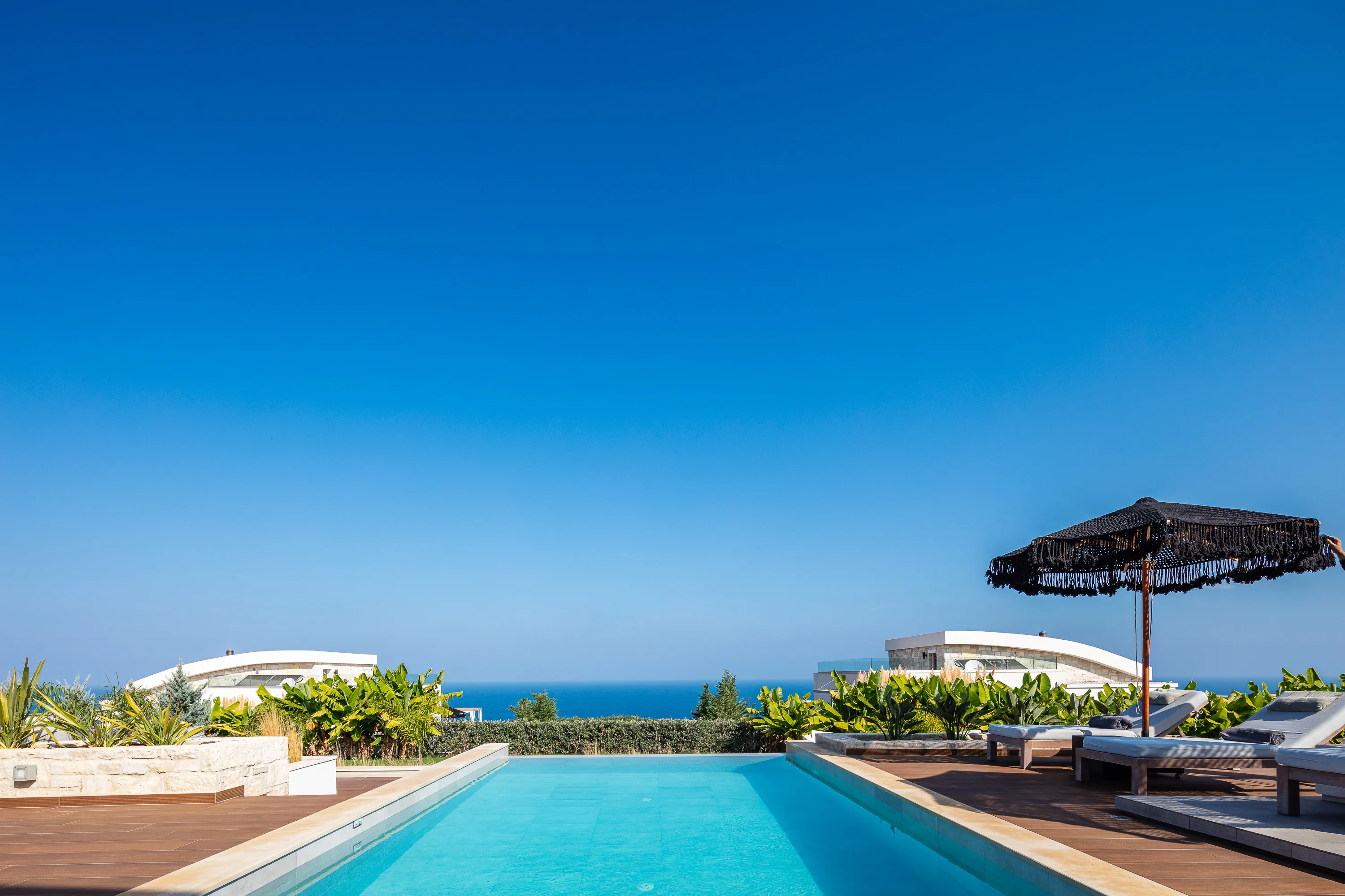 Private pool with panoramic sea views.