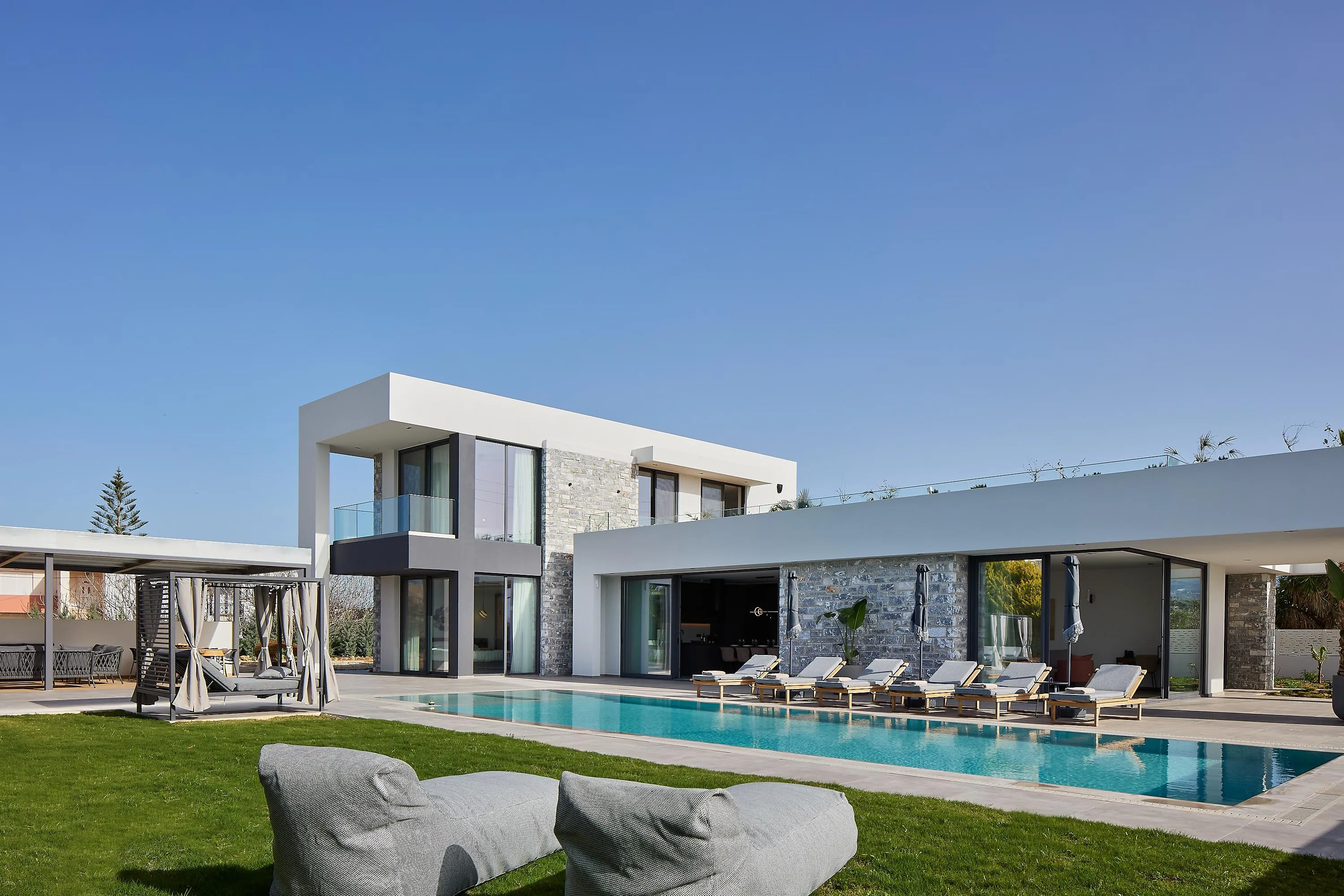 The villa offers a gazebo, 6 sun beds, 2 bean bag loungers, and 4 umbrellas for comfort.