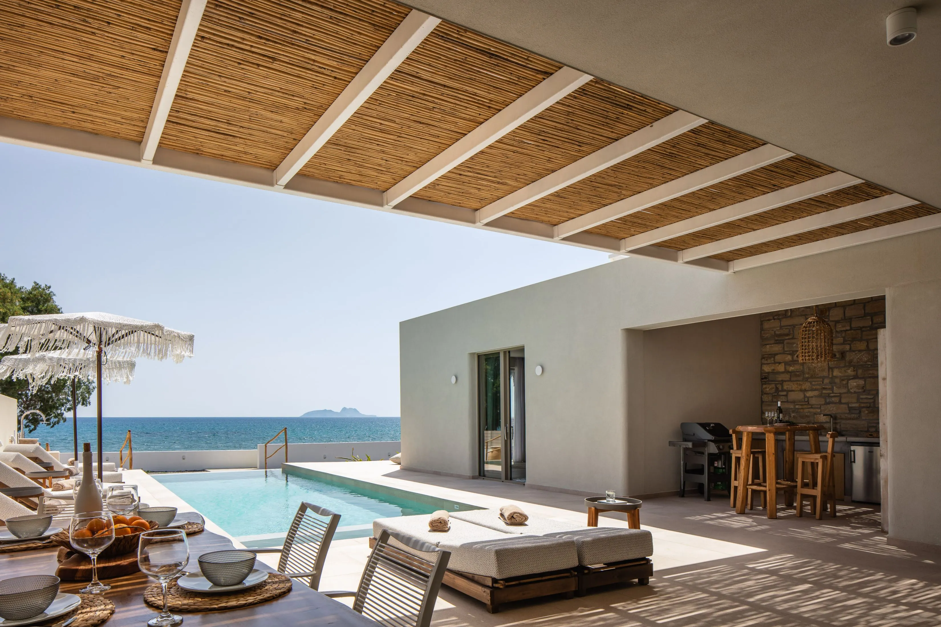 Outdoor seating and dining area next to the pool!