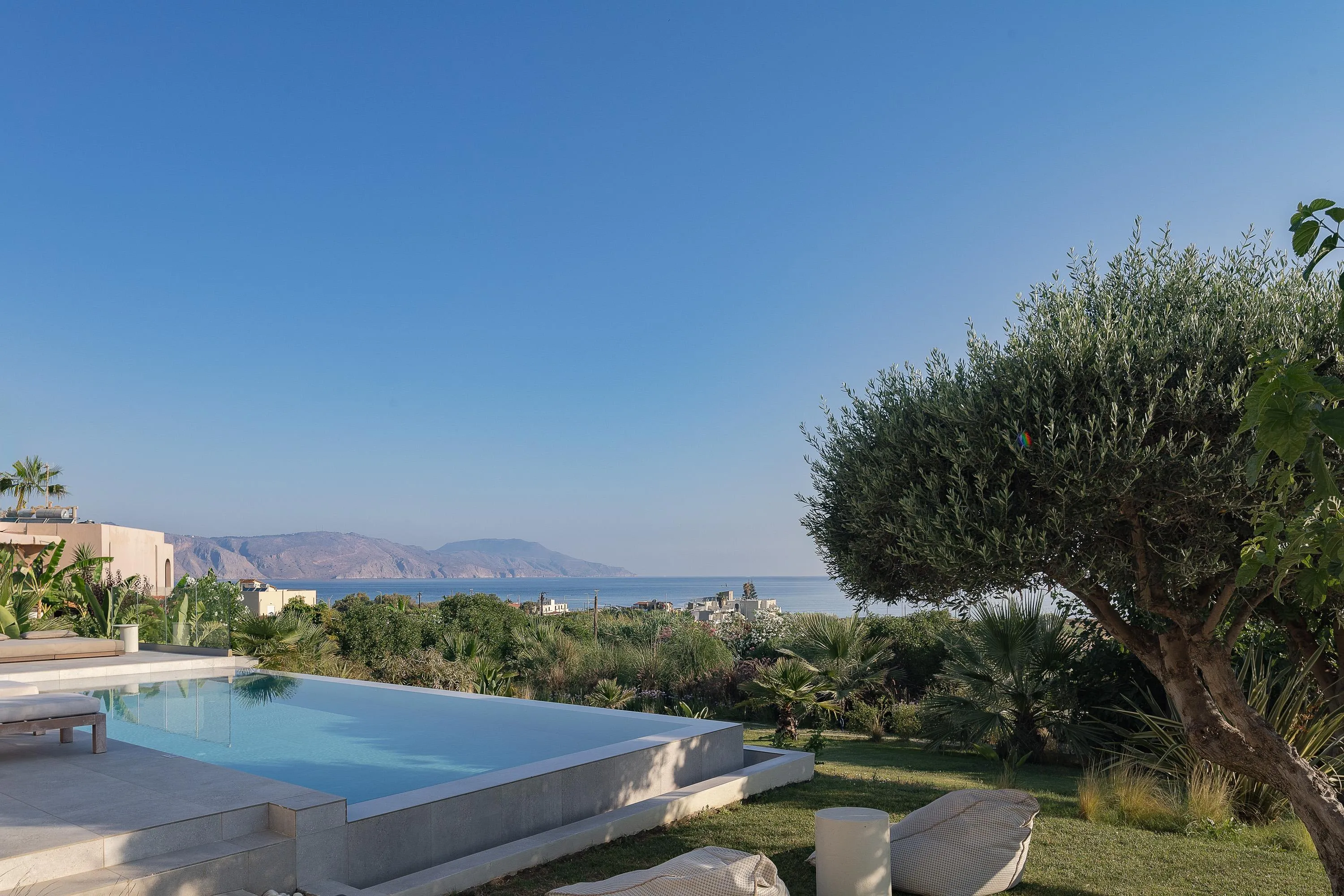Comfortable seating surrounds the pool area