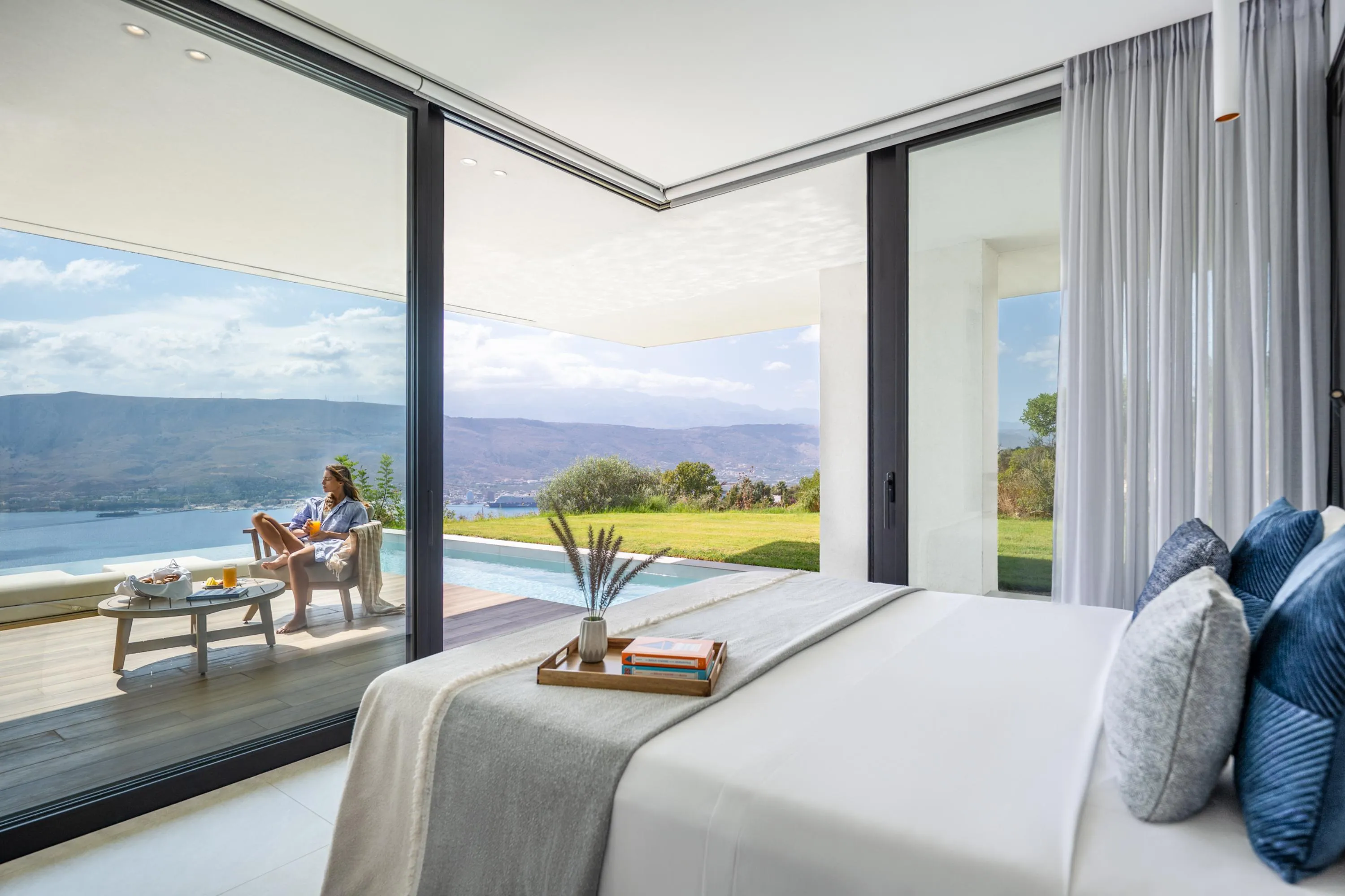 This bedroom on the ground floor features a closet, a full-length mirror, and an ensuite bathroom with a stand-up shower