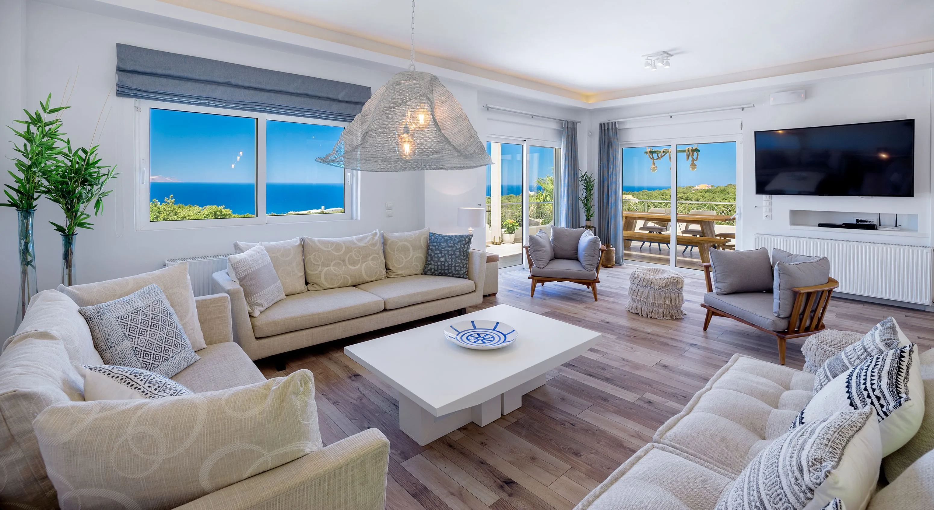 Living room with 3 sofas, armchairs, 65’’ HDTV, Playstation 3 and open fireplace