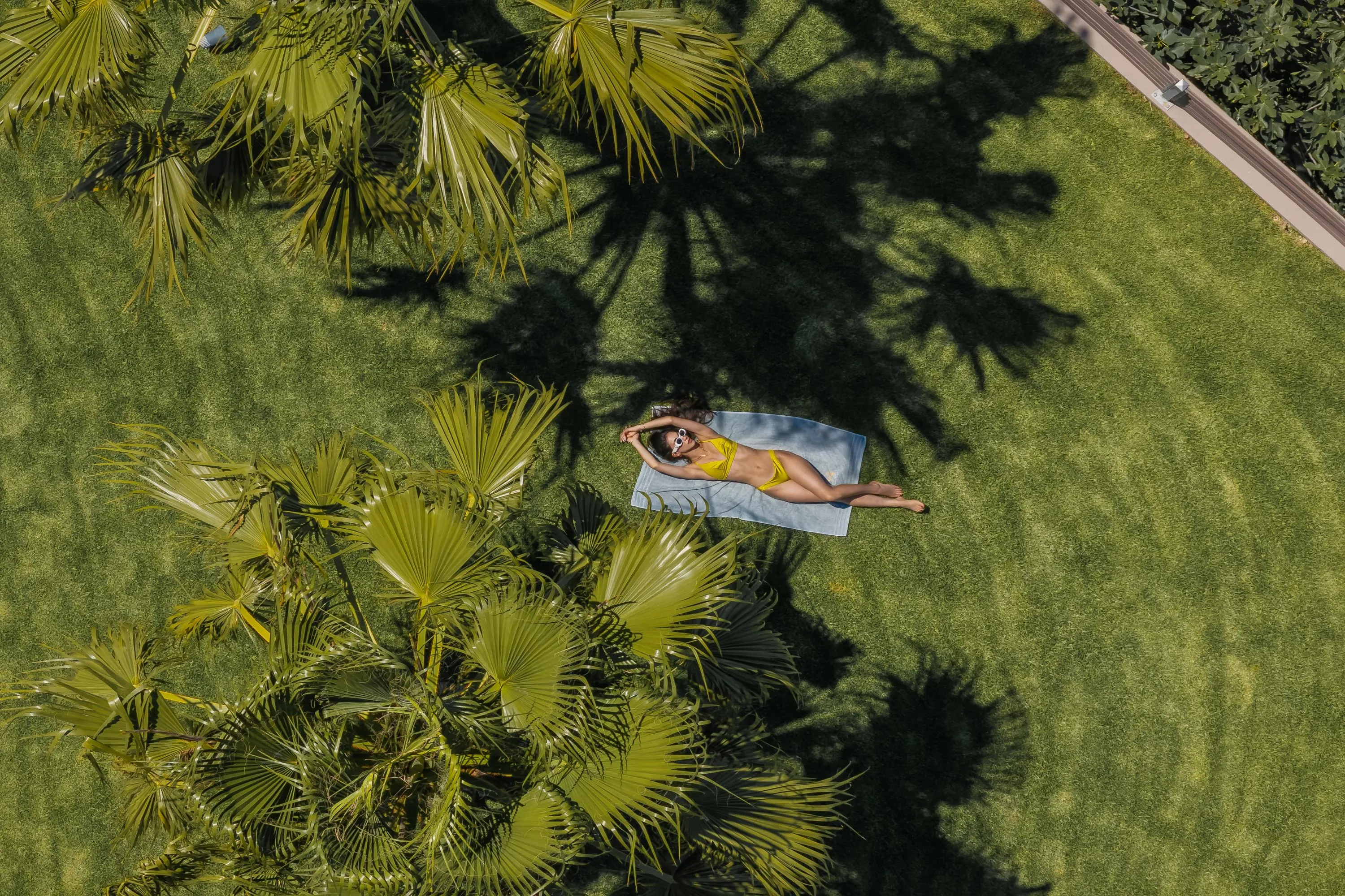 The villa's garden offers several cozy spots to relax.