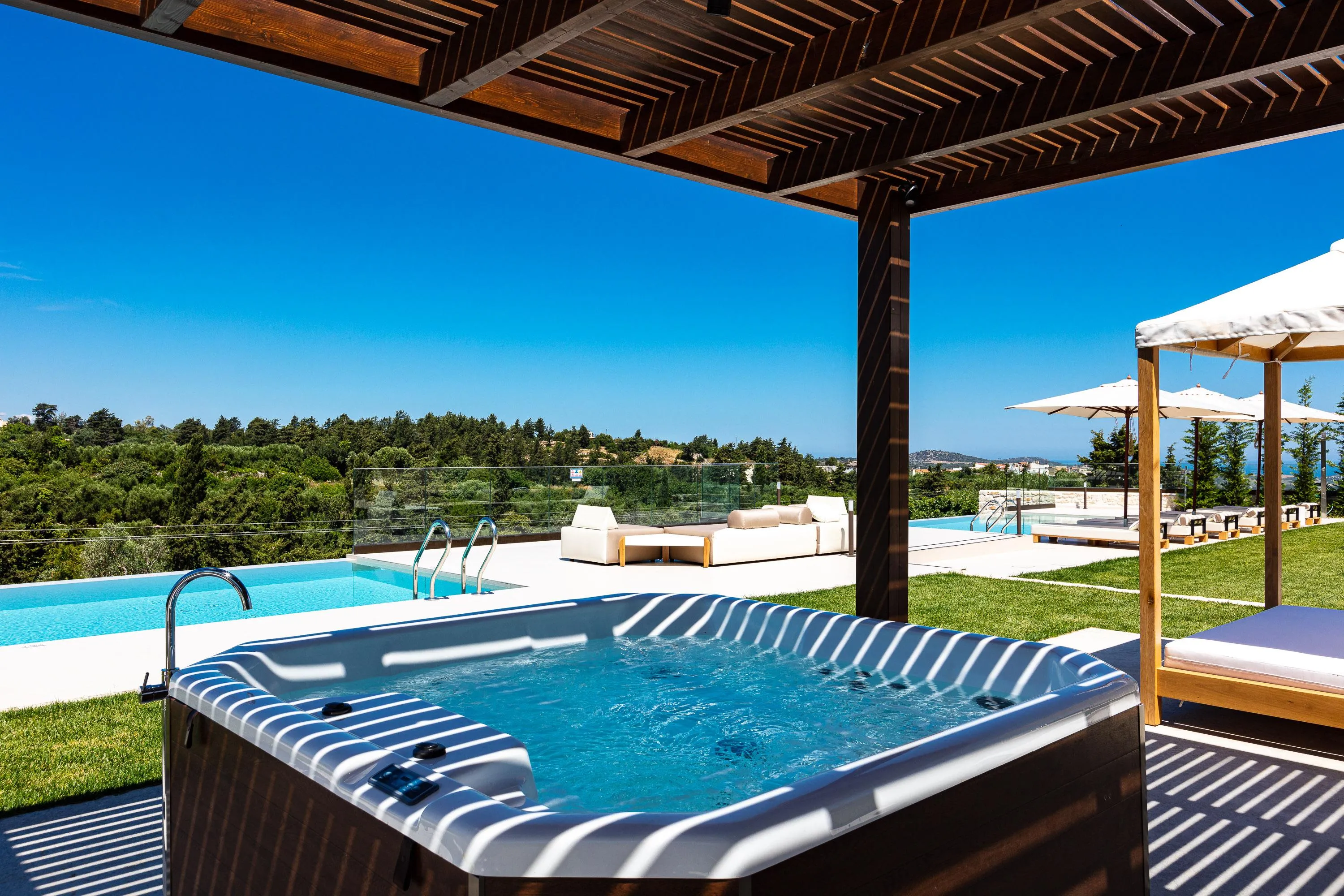Inviting hot tub under a shaded pergola, seating up to 5.