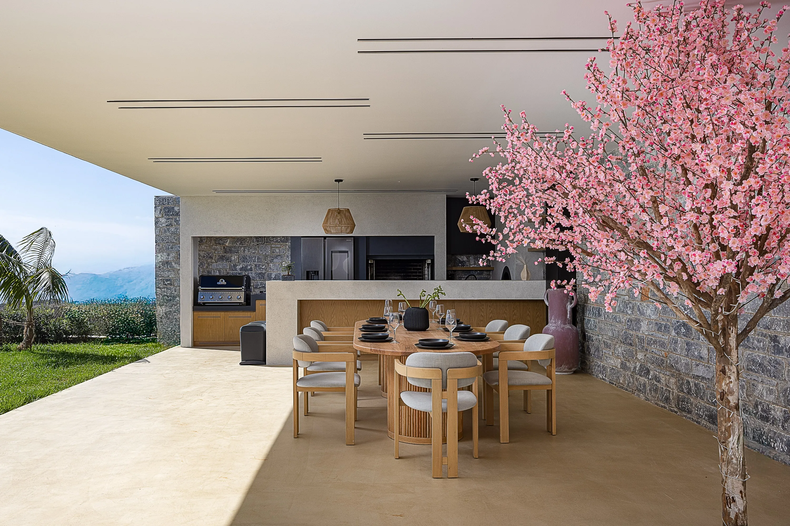Οutdoor dining area for 8 guests under a shaded pergola