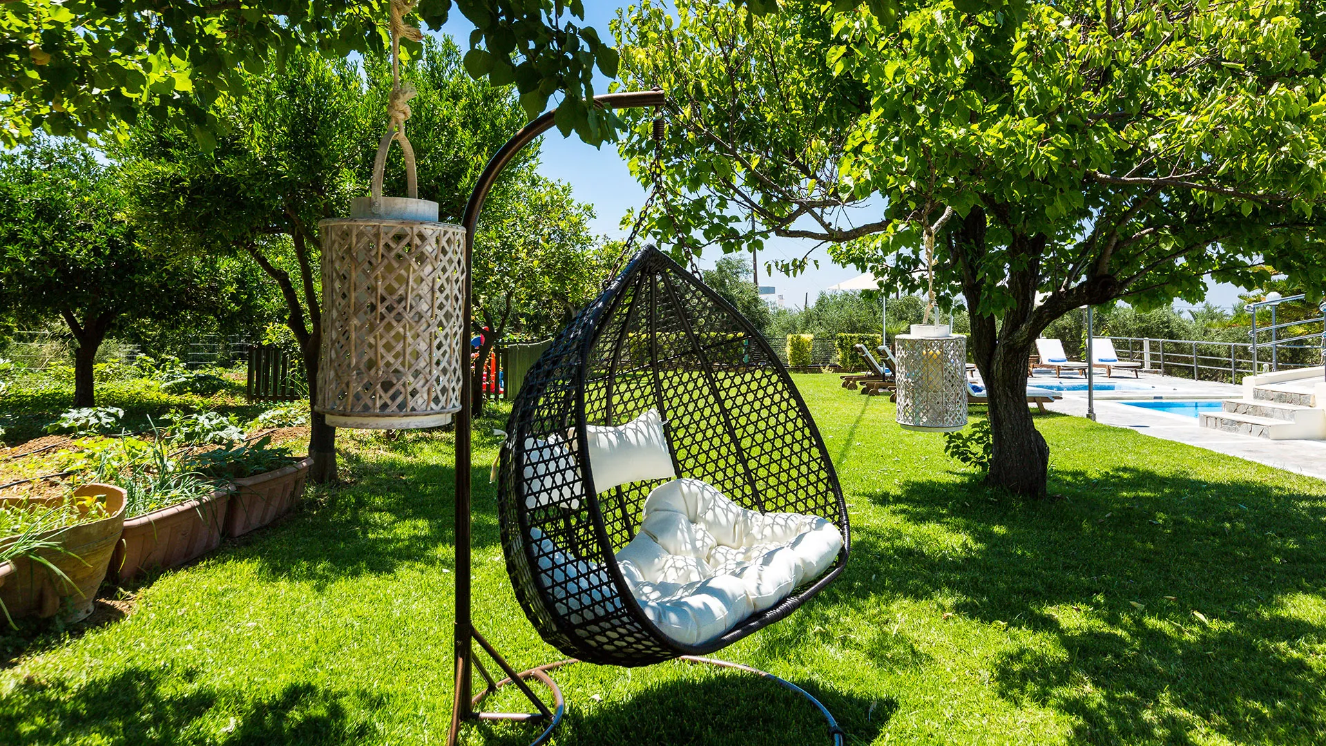 Large lawn covered area around the pool