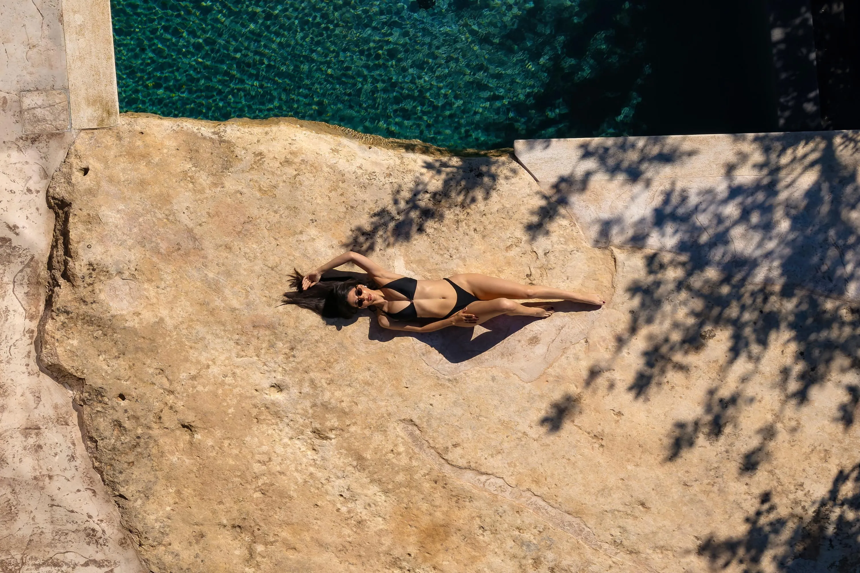 Blending contemporary comforts with its serene natural surroundings, the villa showcases striking natural rock accents throughout, creating a warm and inviting atmosphere