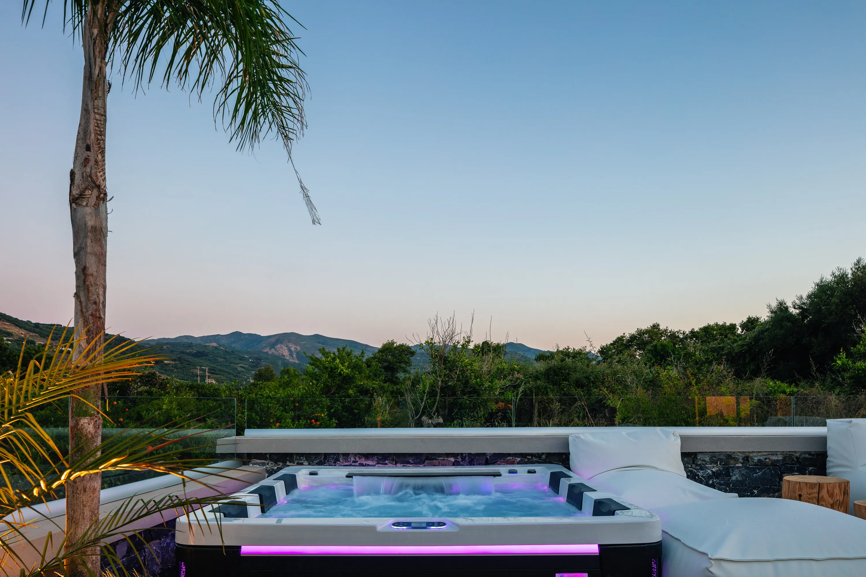 A six-seater hot tub, accompanied by cozy bean bag loungers and poufs for ultimate relaxation!