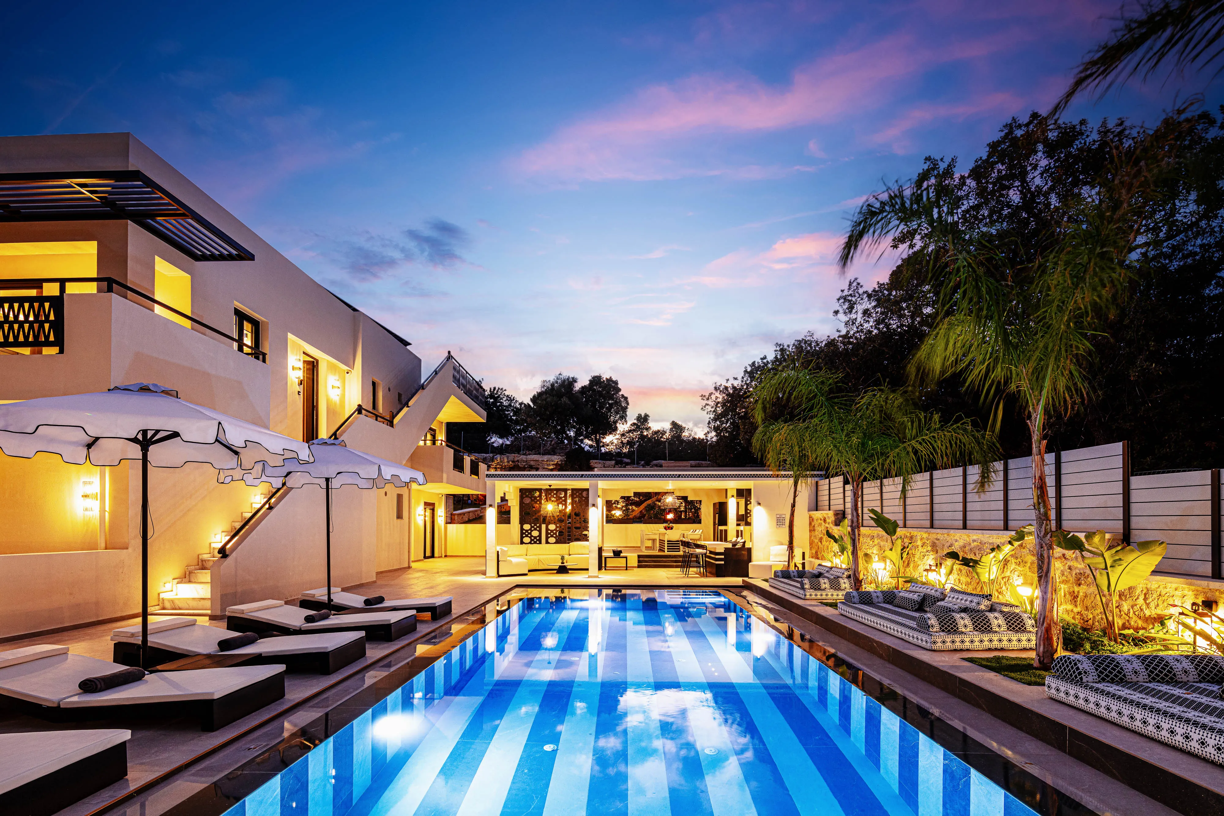 Soft lighting sets the scene for cozy poolside moments.