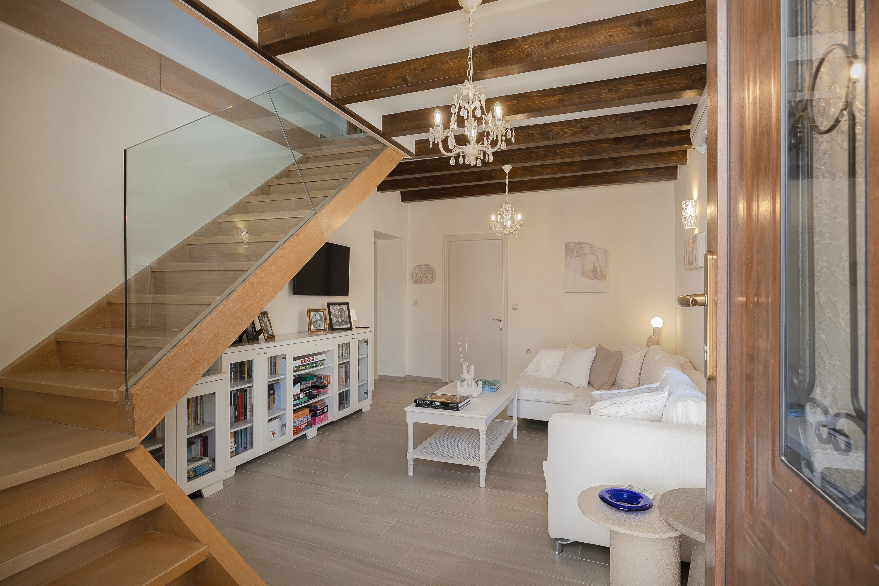 Bright, airy living room with comfy sofa, books, and entertainment for all ages