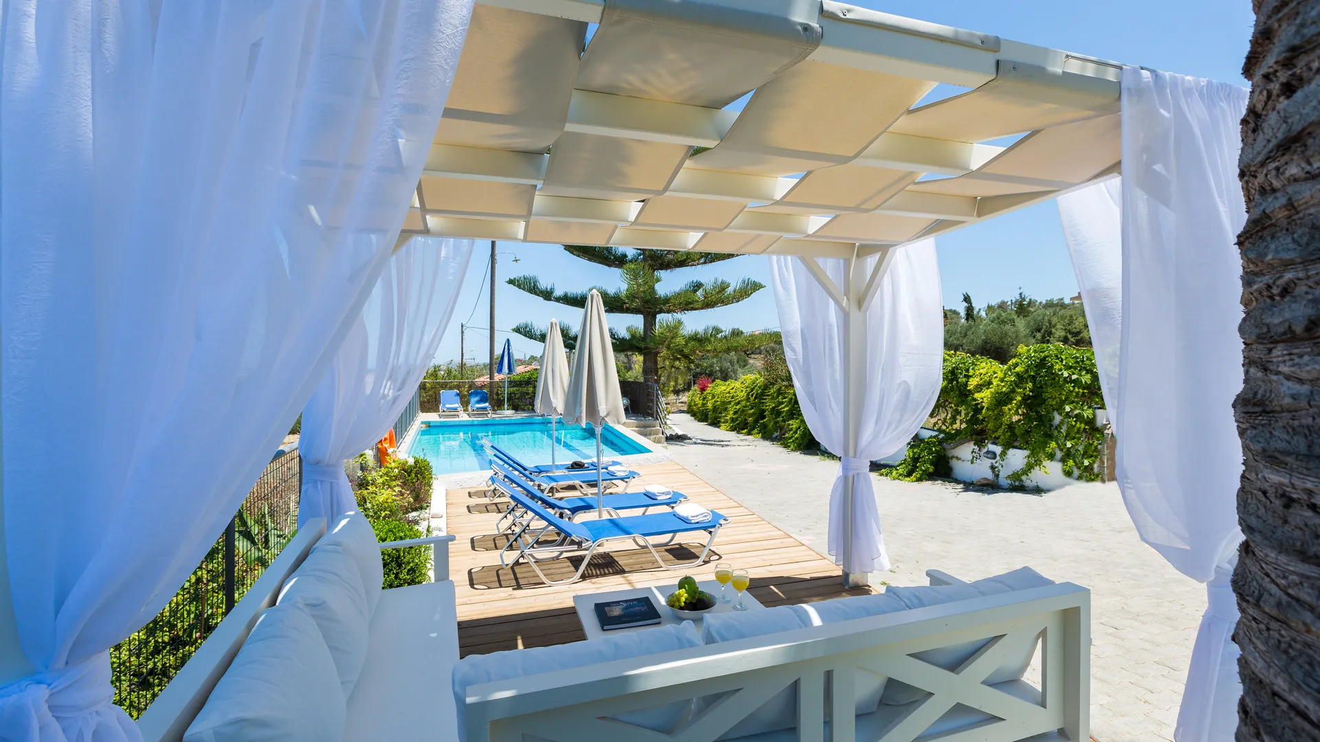 Comfortable outdoor seating area by the pool