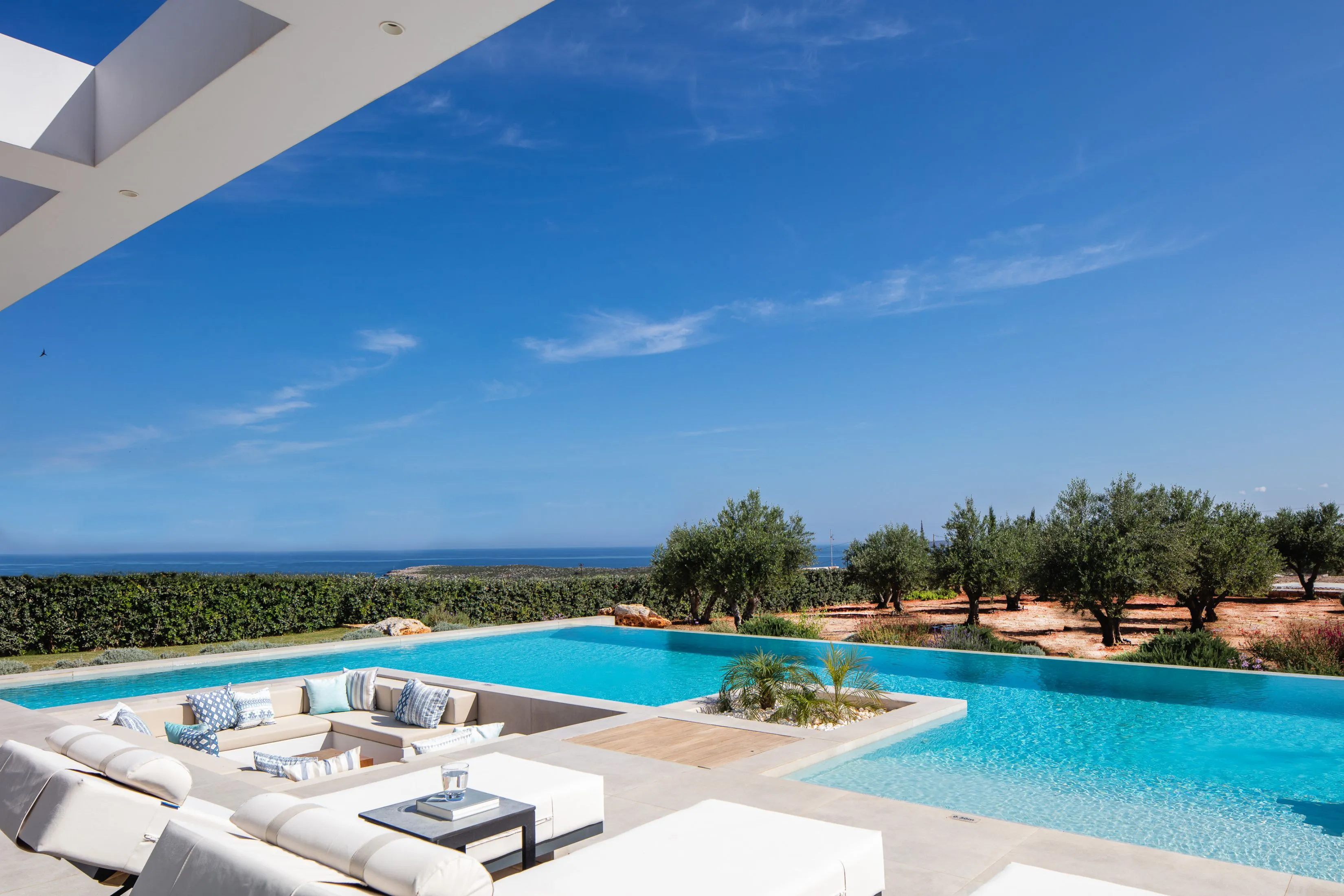 Secluded seating space by the pool for peaceful sunset views