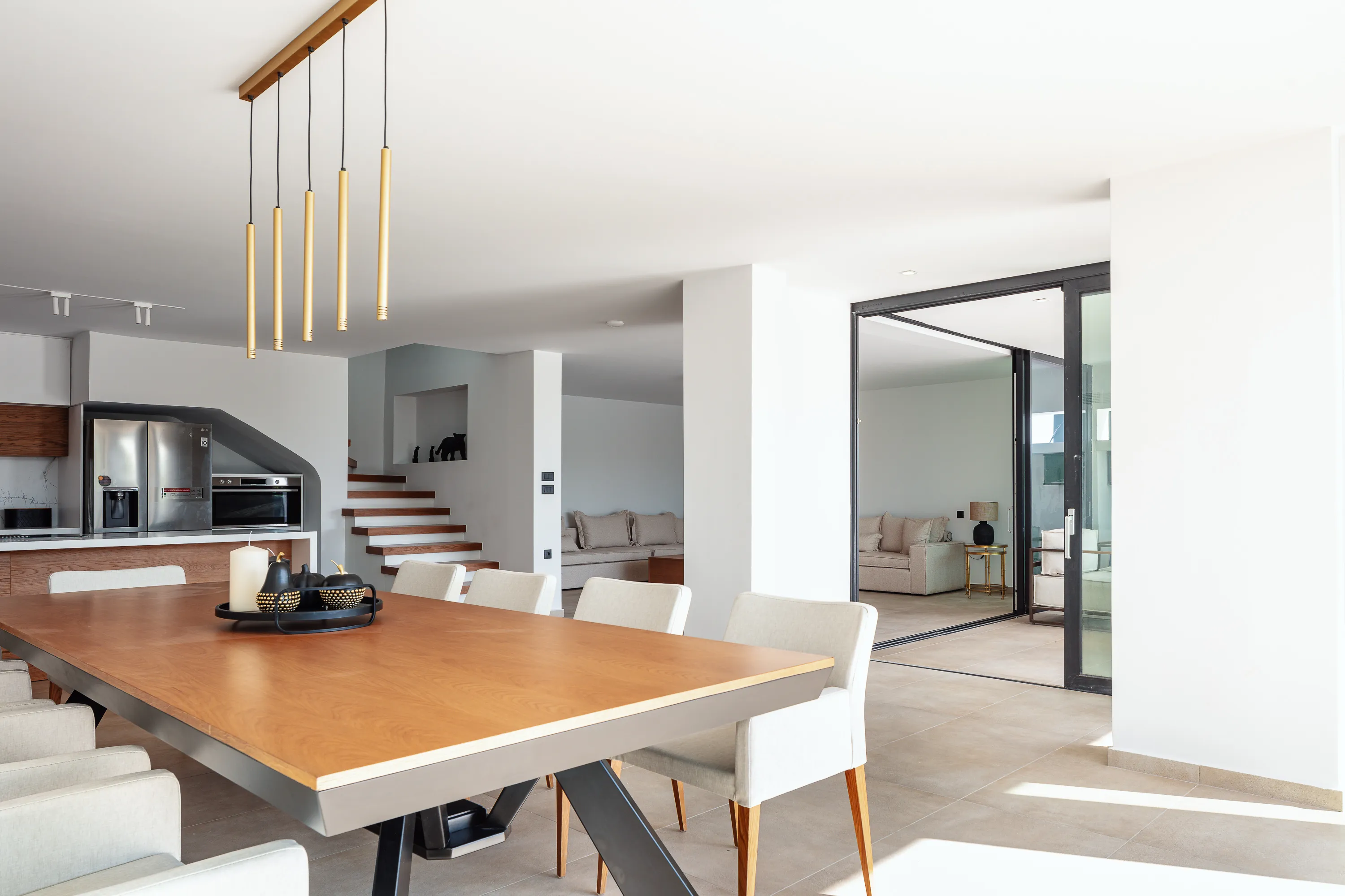 The elegant 10-seat dining table awaits, inviting you to create unforgettable meals and moments with your loved ones.