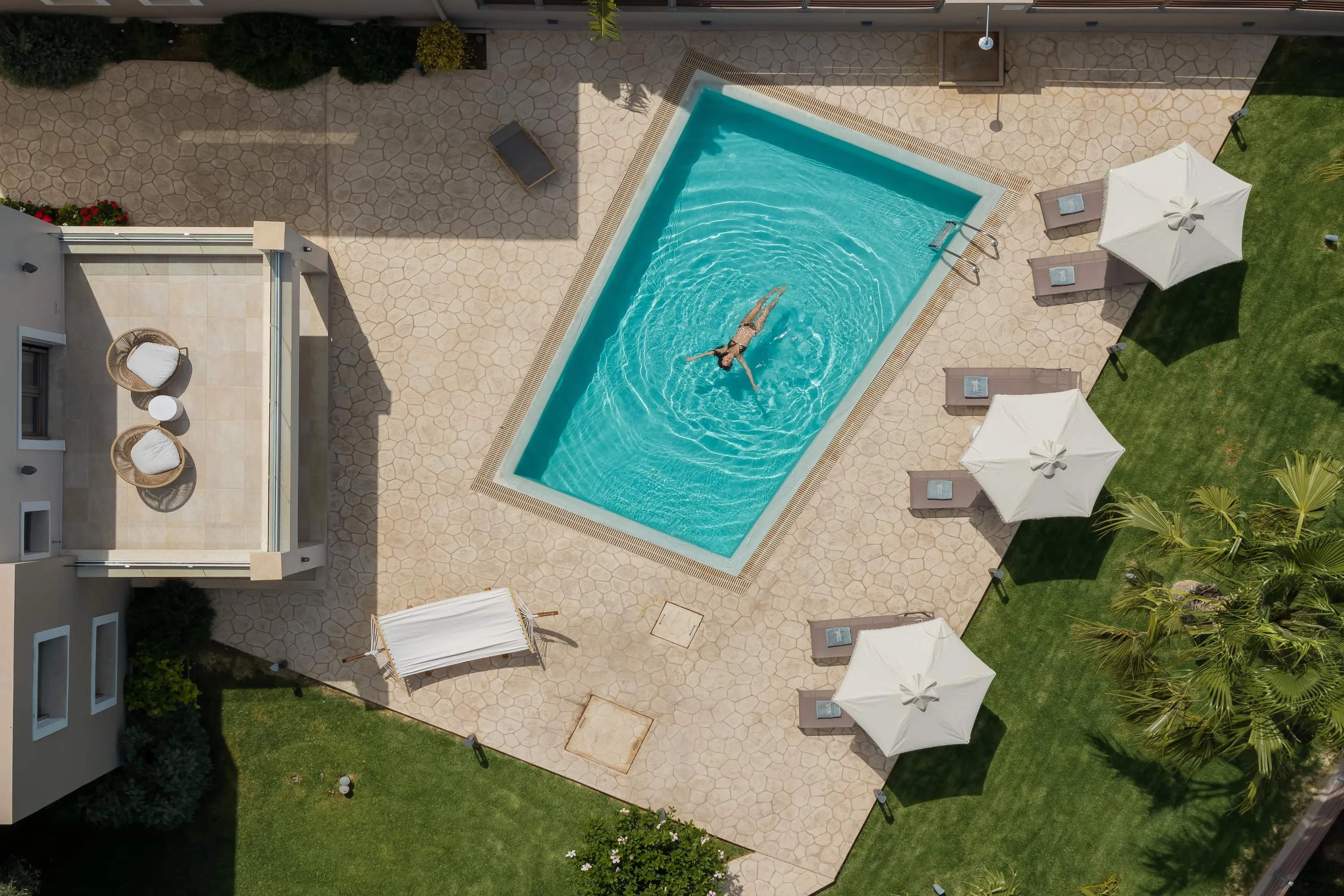 Dive into crystal-clear waters in your private pool.
