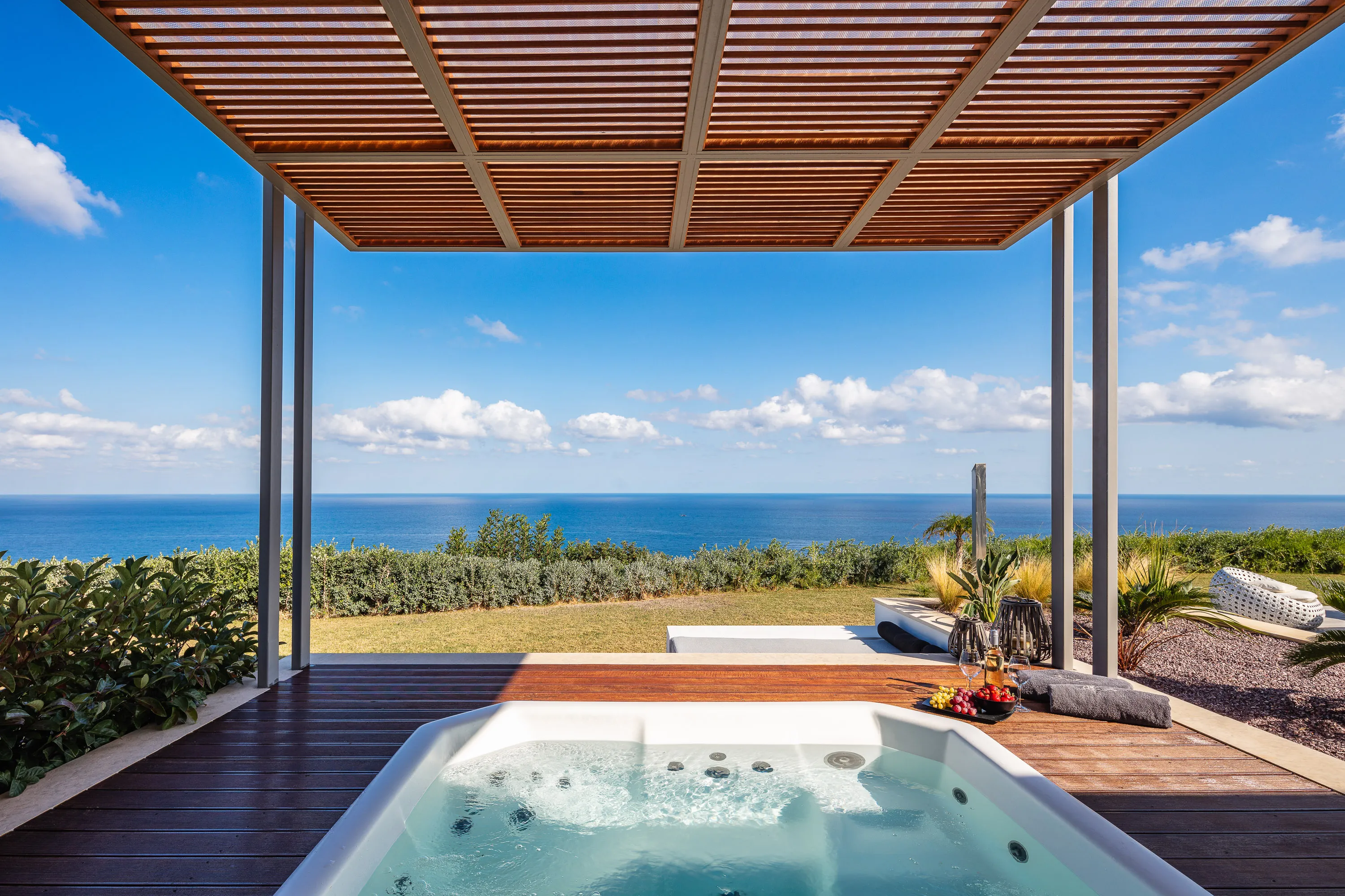 Soak in comfort with stunning sea views.