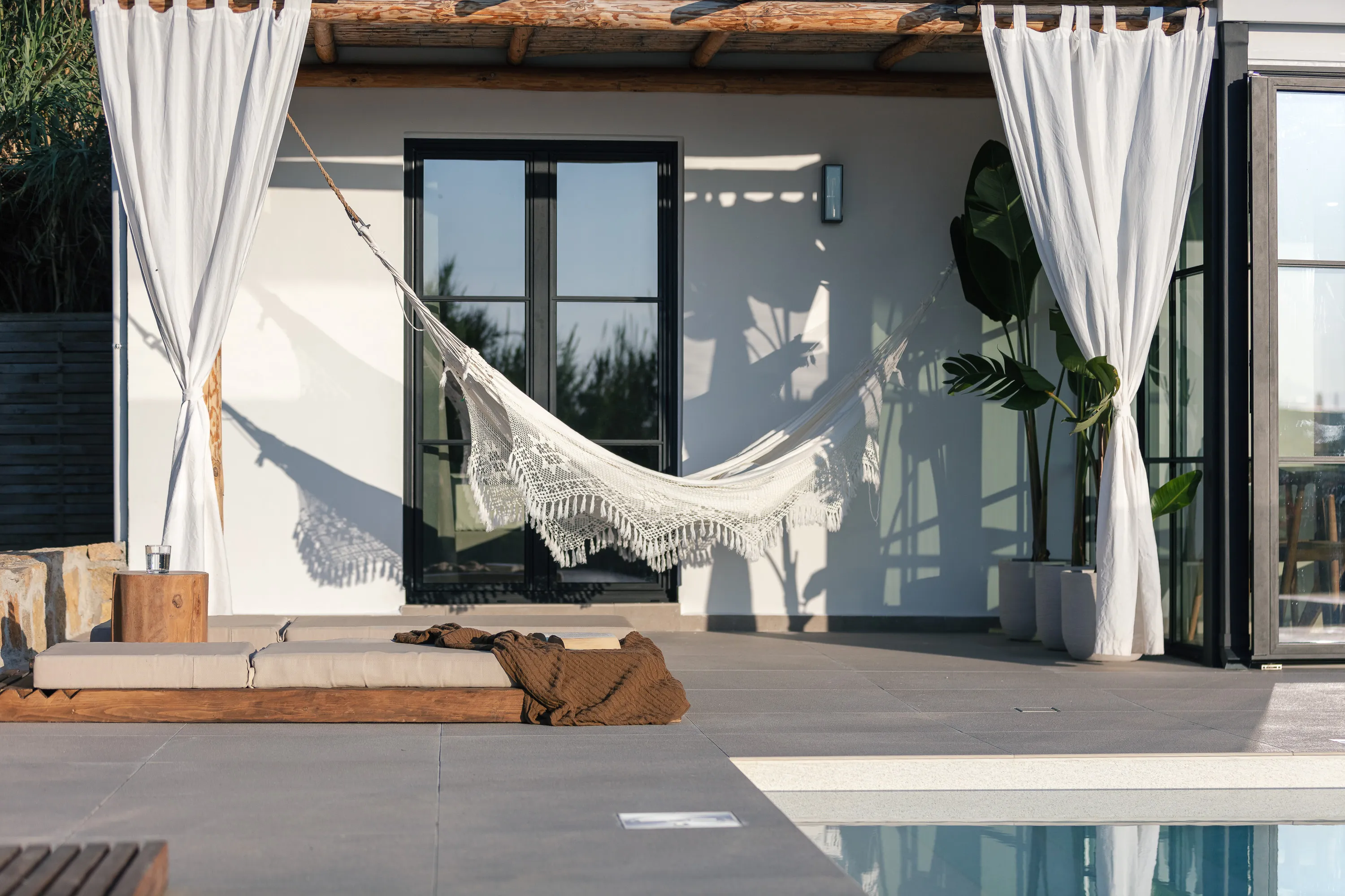 There is a beautiful hammock and an outdoor siting area by the pool, ideal for relaxation.