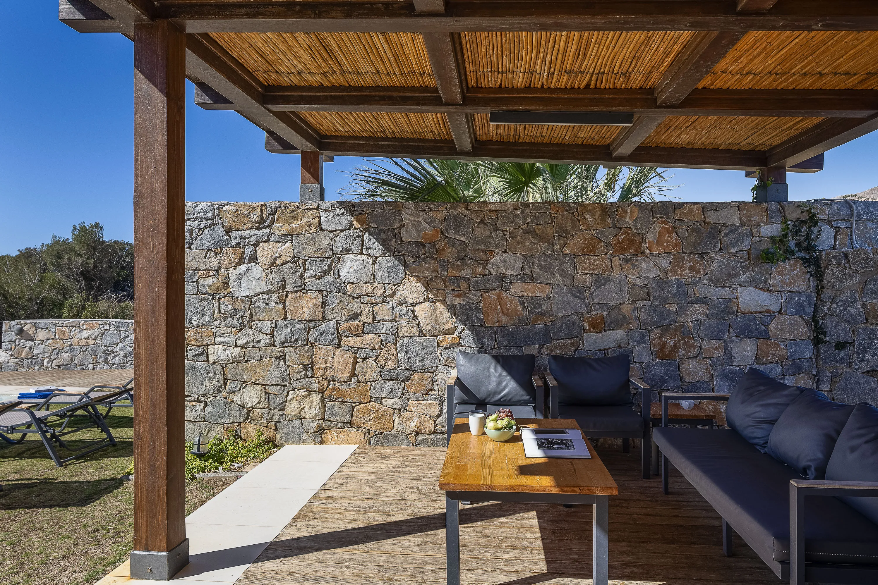 Outdoor living room under the shade of a pergola