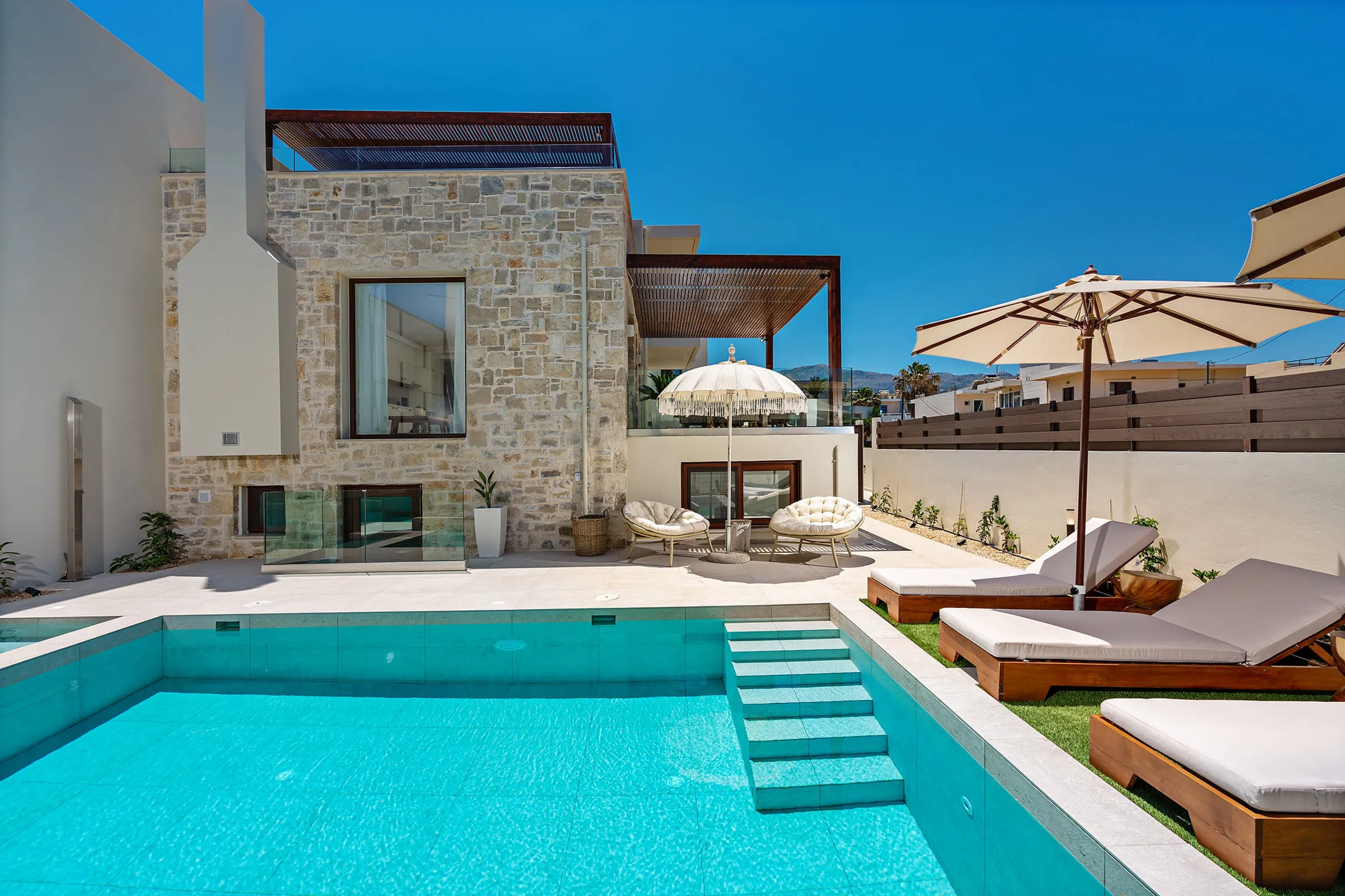 Comfortable sun beds, a day bed and umbrellas are available by the pool!